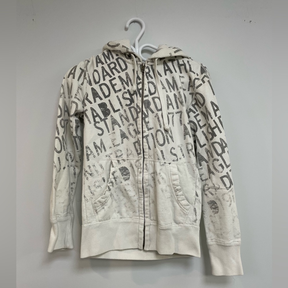 American Eagle White with grey fading letter print zip-up hoodie.